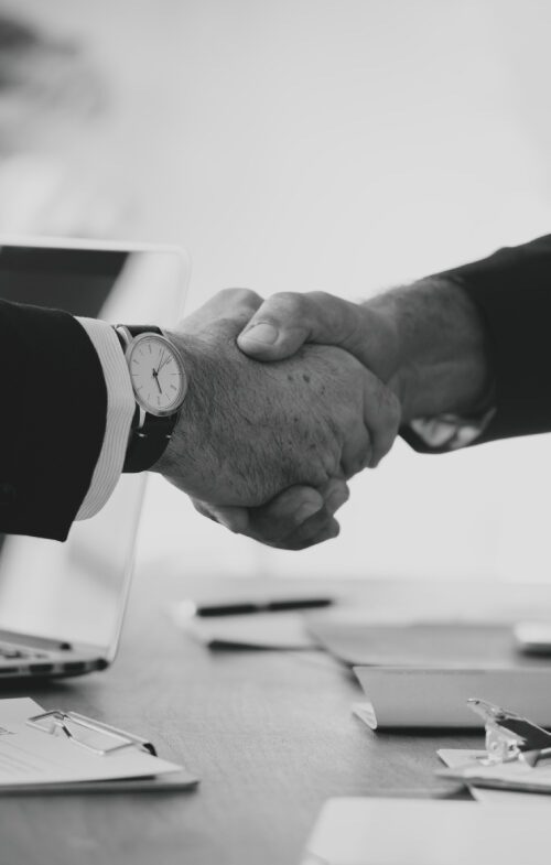 Business people shaking hands together